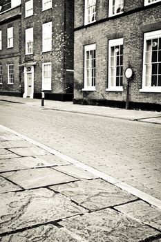 Cobbled street in an English town in monochrome