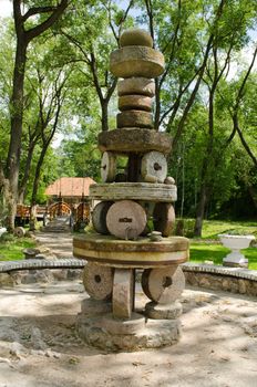 rural park decoration figure made of retro vintage millstones mill stones.
