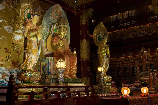 Buddha in Tooth Relic Temple interior in China Town, Singapore 
