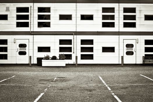 Exterior of a modern warehouse or office block in monochrome