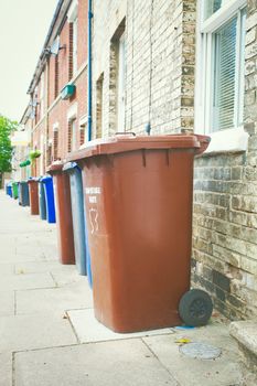 Row of plastic bins for collection in England