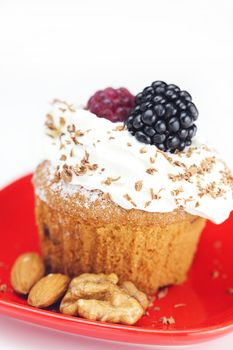 muffin with whipped cream,mint, raspberries, blackberries and nuts