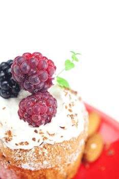 muffin with whipped cream,mint, raspberries, blackberries and nuts