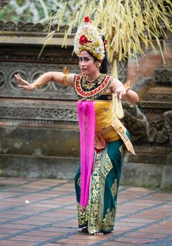 UBUD, BALI, INDONESIA - SEP 21: Unidentified woman performs Legong dance, the traditionala form of Balinese dance on Sep 21, 2012 in Ubud, Bali, Indonesia. Legong is popular tourist attraction on Bali