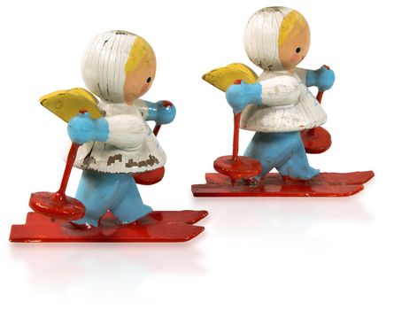 Two wooden and vintage small figurines of angels skiers