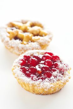 beautiful cake with berries on a white background