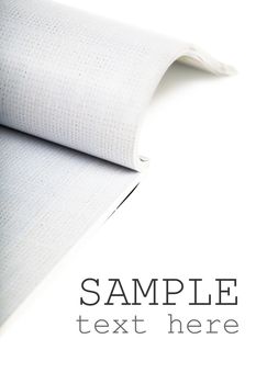 Selective focus image of magazine over white background