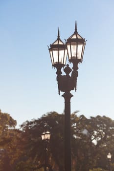 two old lanterns against the blue sky