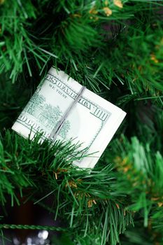 stack of dollars on the Christmas tree