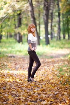 young redhead teenager woman in the forest  