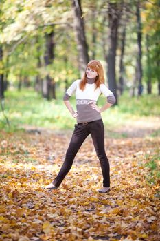 young redhead teenager woman in the forest  