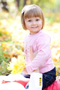 beautiful little girl on the autumn forest