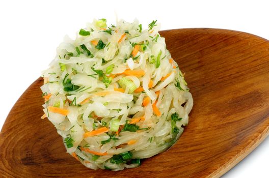 Salad of Sauerkraut with Spring Onion, Dill and Carrot on Wooden Plate closeup on white background