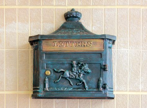 Antique metal letter box on the wall 