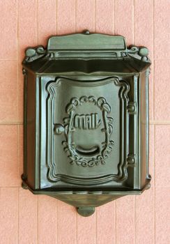 Antique metal mail box on the wall 