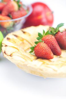 apple pie, apples and strawberries isolated on white