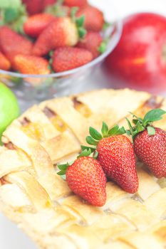 apple pie, apples and strawberries isolated on white