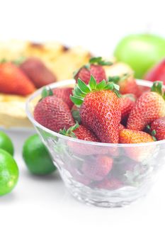 apple pie,lime, apples and strawberries isolated on white