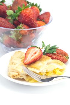 piece of apple pie, fork and strawberries isolated on white