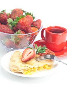 piece of apple pie, fork,cup of tea and strawberries isolated on white