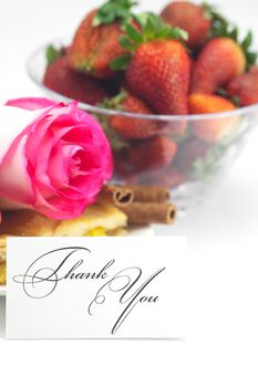 piece of apple pie, a card with the words thank you, cinnamon, pink rose, almonds and strawberries isolated on white