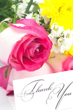 roses, chamomile, chrysanthemums and a card with the words thank you isolated on white