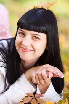 portrait of a beautiful young woman in autumn forest