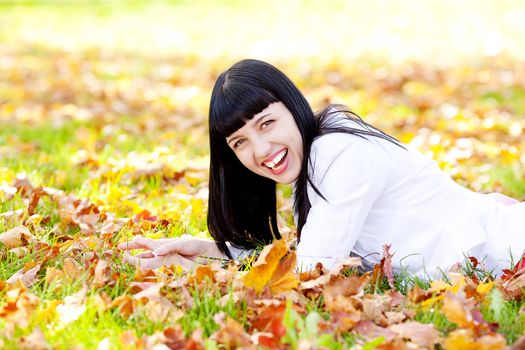 portrait of a beautiful young woman in autumn forest