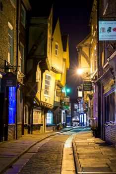 YORK, UK - MARCH 30: The Shambles is a former butchers' street in York with some buildings dating back from the fourteenth century . March 30, 2013 in York.