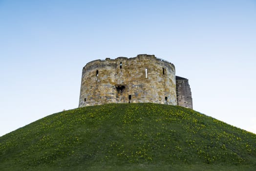 East face of Clifford's Tower, in York, UK. The tower is part of the York castle.