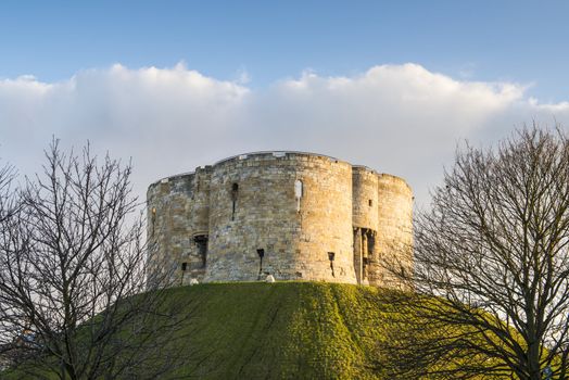 North face of Clifford's Tower, in York, UK. The tower is part of the York castle.