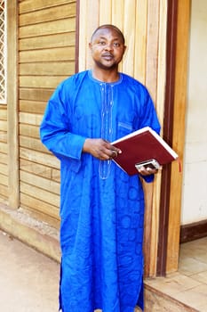 African business man in blue traditional or ethnic clothes.