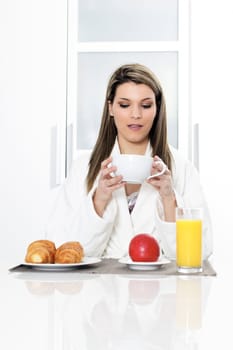 beautiful blond woman at breakfast at home