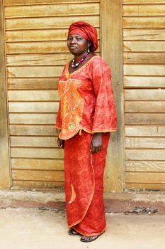 Full body shot of mature African woman in traditional clothing or boubou