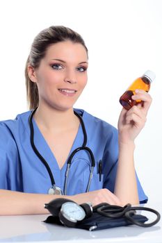 woman doctor with medicine bottle in the hand