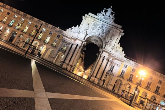 famous arch at commerce square at Lisbon by night