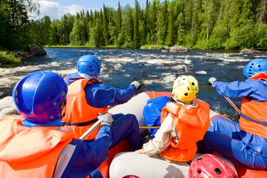 Rafters in a rafting boat on Pistojoki river in Karelia, Russia