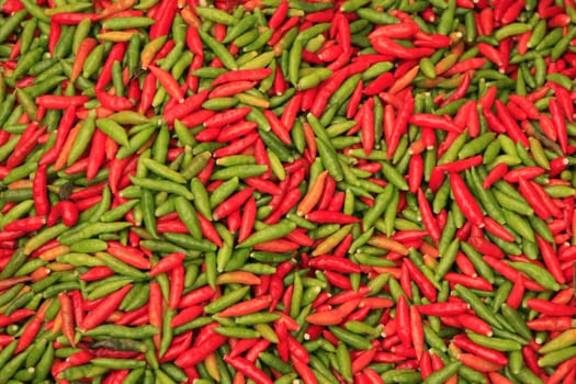 Red and green chili peppers background