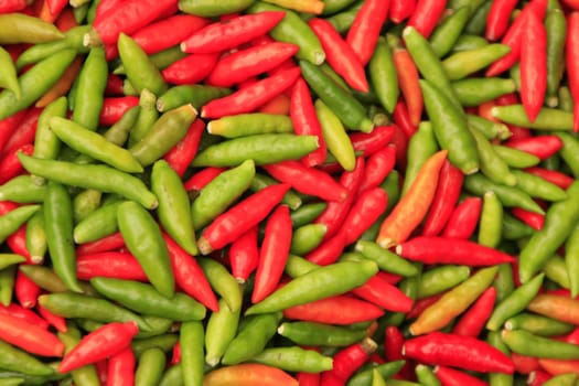 Red and green chili peppers background