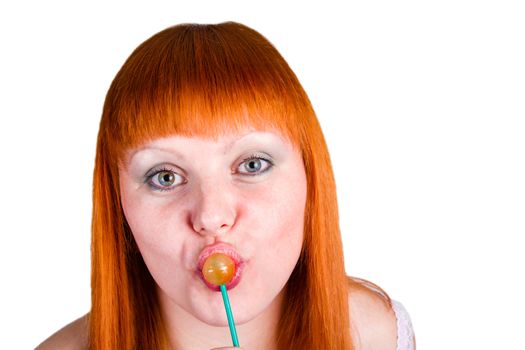 Young pretty woman with lollipop on her lips. Isolated over white background.