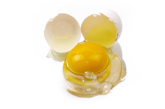 a broken egg on a white background isolated