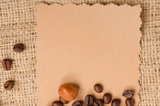 old paper for recipes and spices on burlap closeup