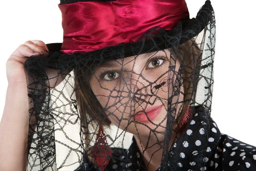 Cute young woman with spider web veil and red hat