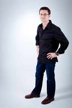 attractive adult man with glasses and black shirt portrait 