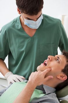 Patient showing tooth problem to the dentist