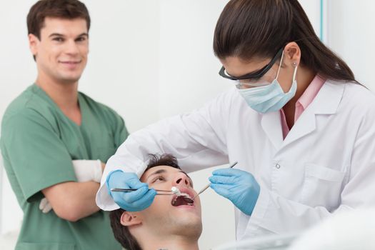 Close-up of medical dentist procedure of teeth cleaning