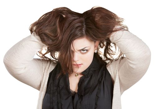 European woman on white holding messy hair