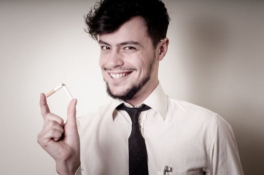 businessman stop smoking on gray background