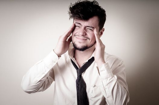 stressed businessman on gray background