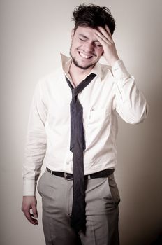 stressed businessman on gray background